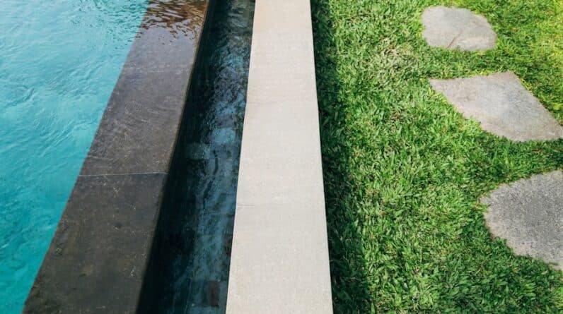 Photo "What Role Does Landscaping Play in Enhancing the Overall Pool Area Aesthetics?"